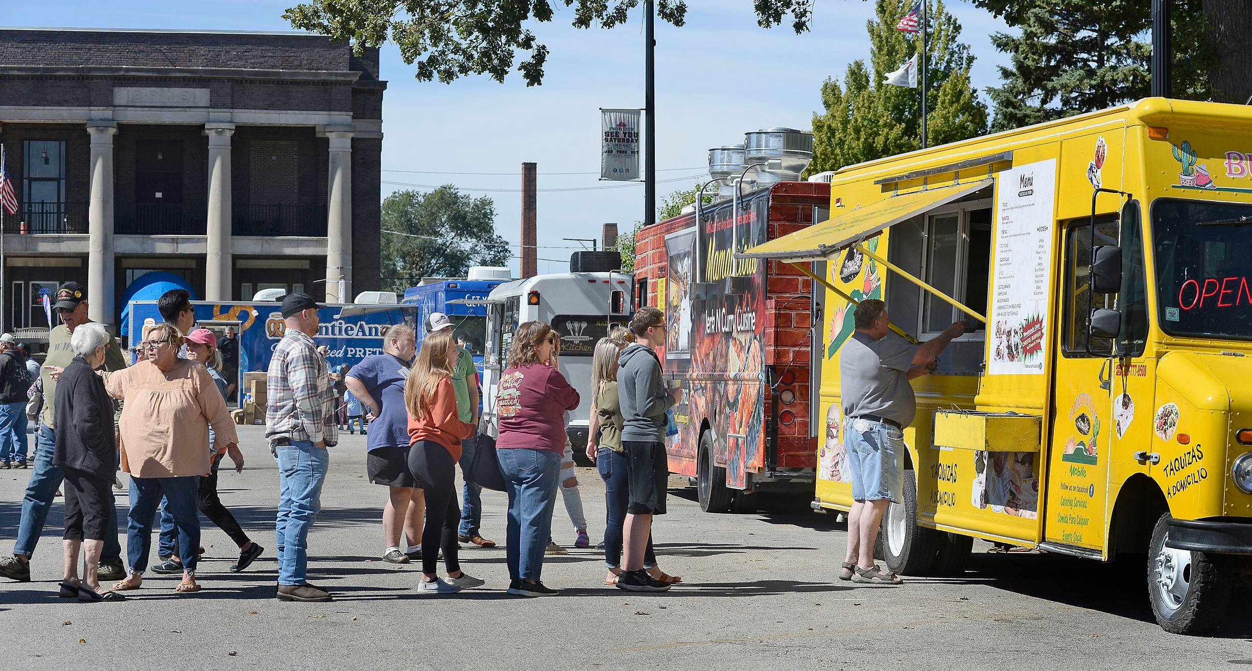 Visitors lined up for several different food offerings Saturday, Sept. 25, 2021, during the Food Truck Festival at City Park in Streator. The festival was sponsored by Streatscapes, the same group responsible for Walldogs.