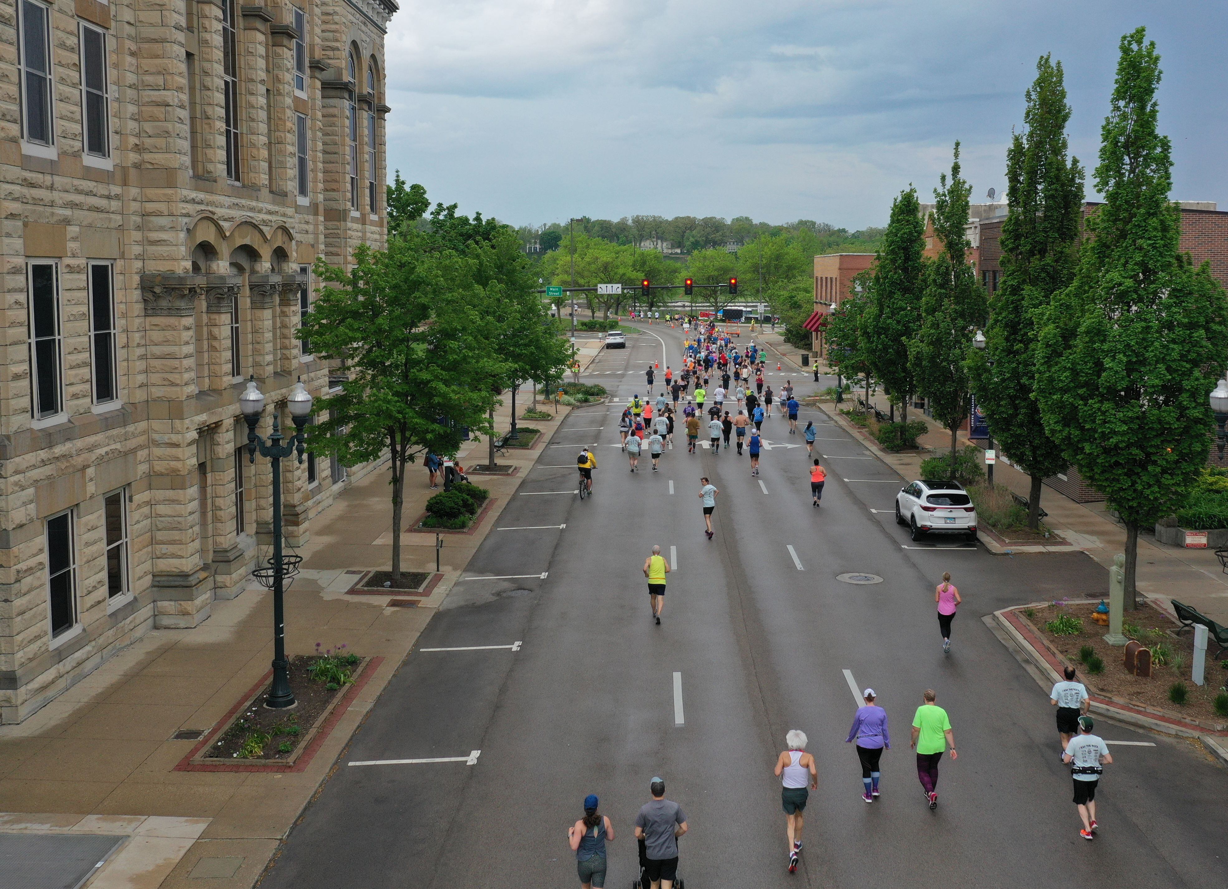 Runners race down La Salle Street infront of the La Salle County Courthouse for the Starved Rock Country Marathon and Half Marathon on Saturday, May 14, 2022 downtown Ottawa. 