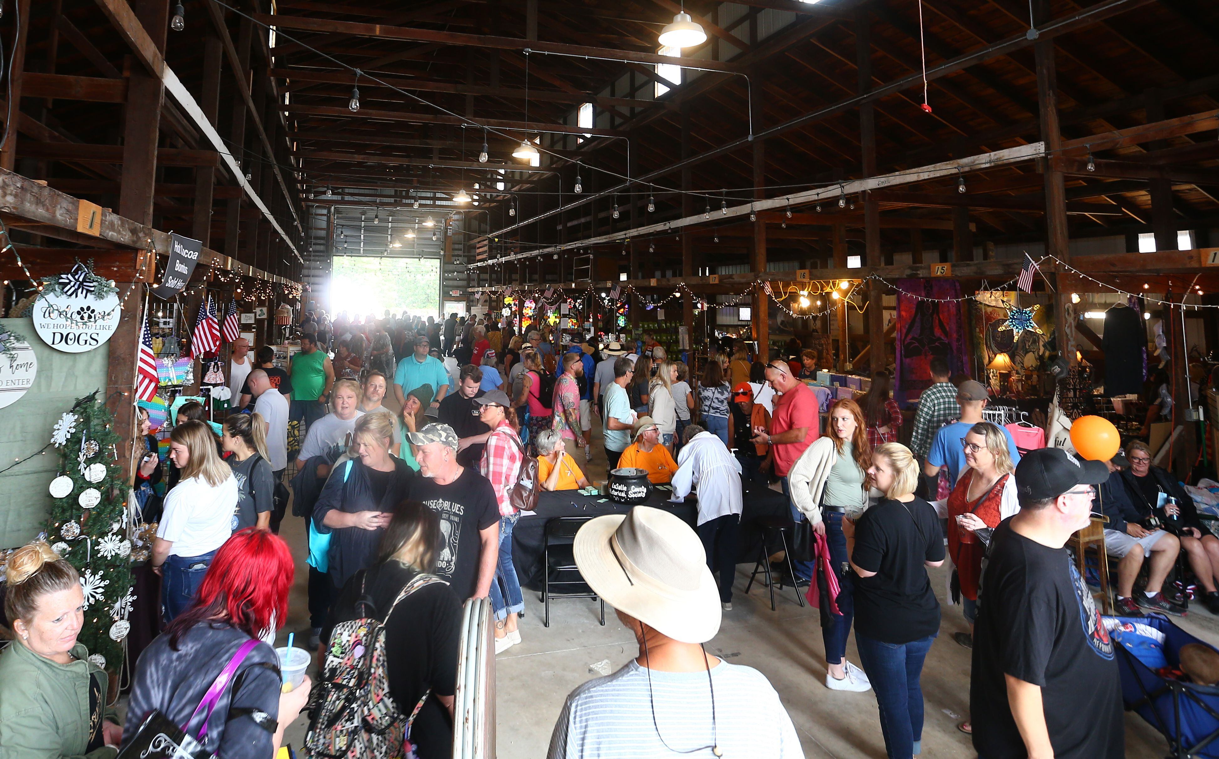 People gather inside the Canal Market building for the 51st annual Burgoo festival on Sunday Oct. 10, 2021.