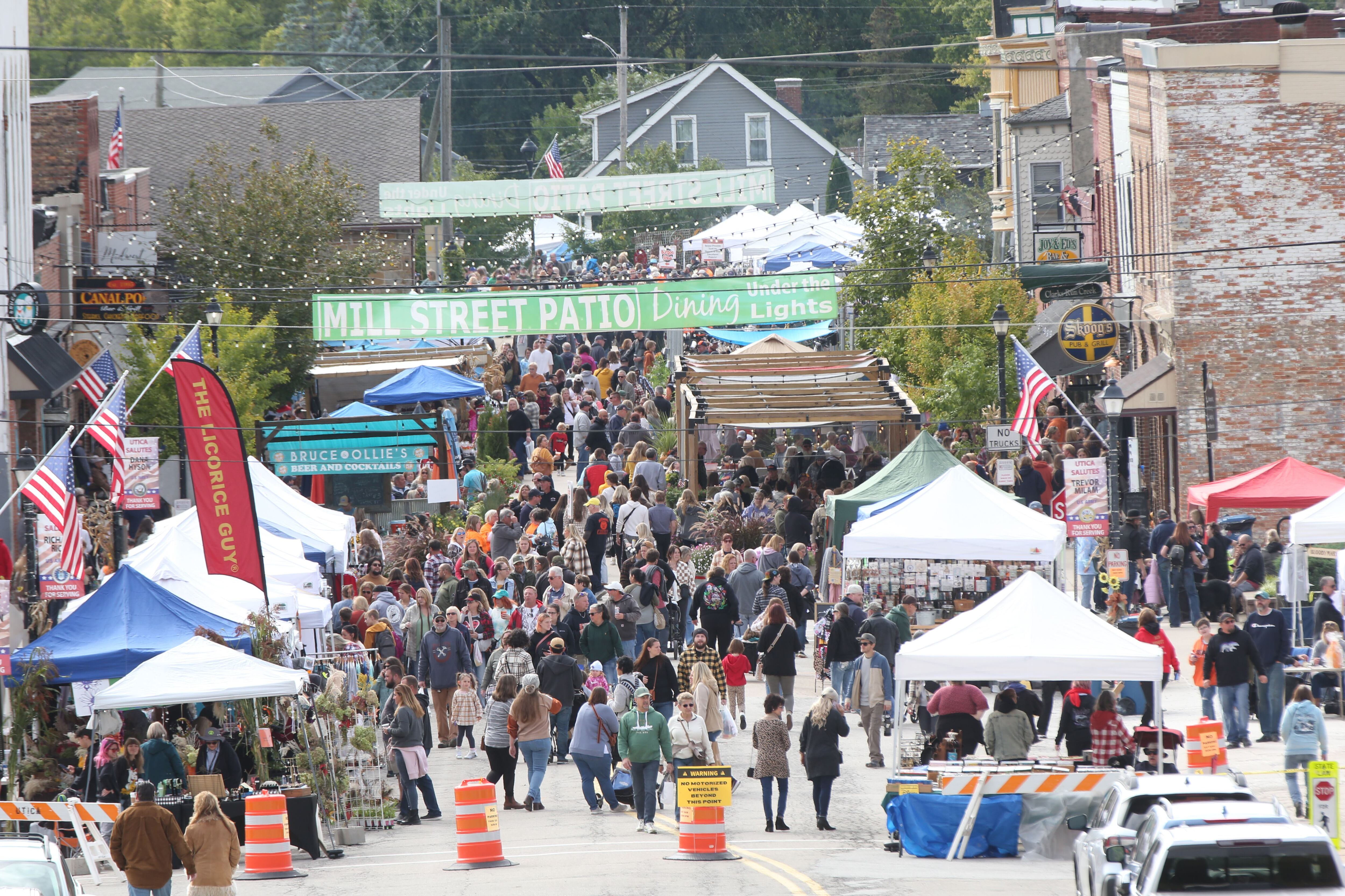 People walk down Mill Street for the 53rd annual Burgoo on Sunday, Oct. 8, 2023 downtown Utica.