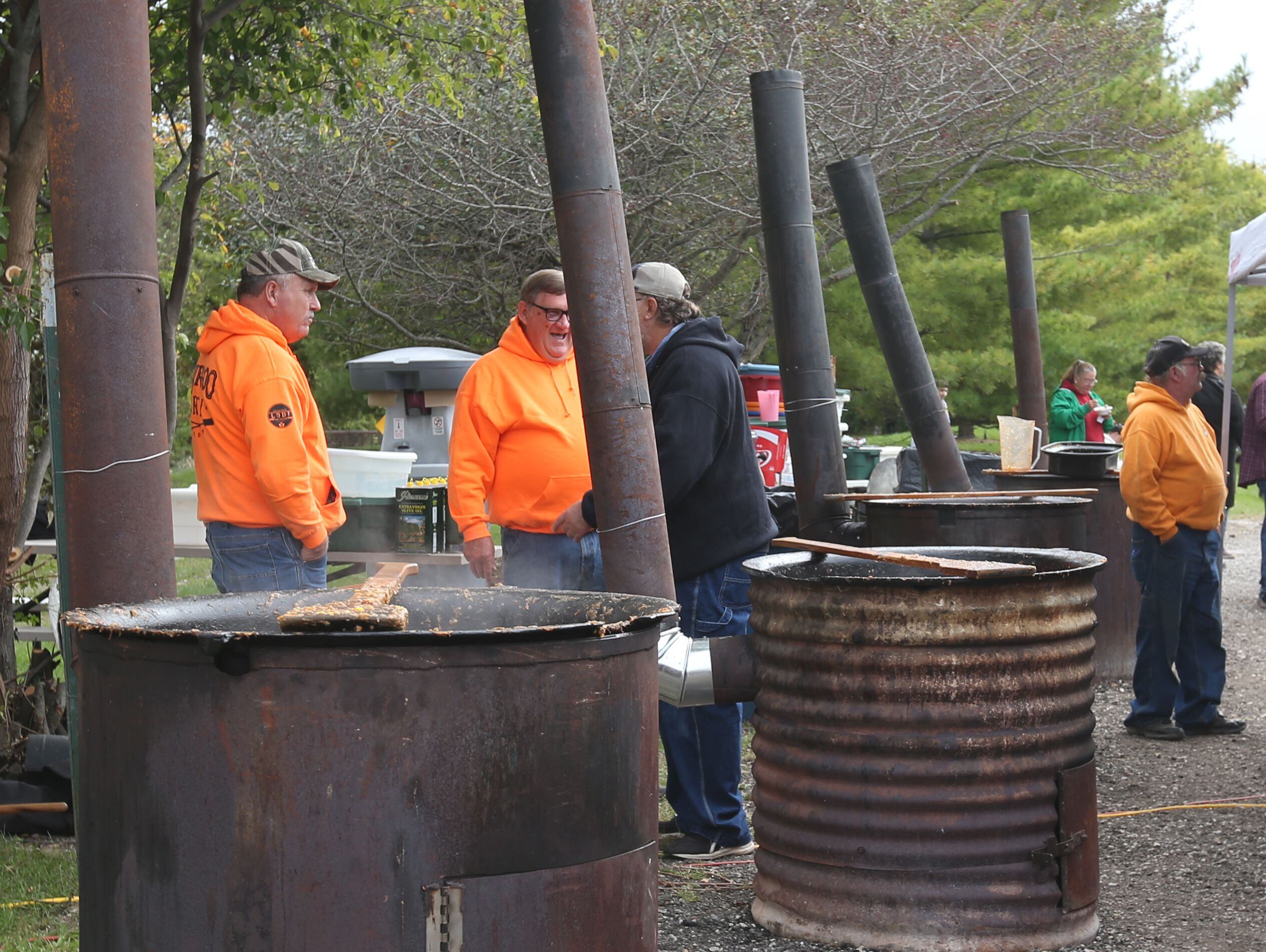 Volunteers help stir large kettles of Burgoo during the 53rd annual Burgoo on Sunday, Oct. 8, 2023 downtown Utica.
