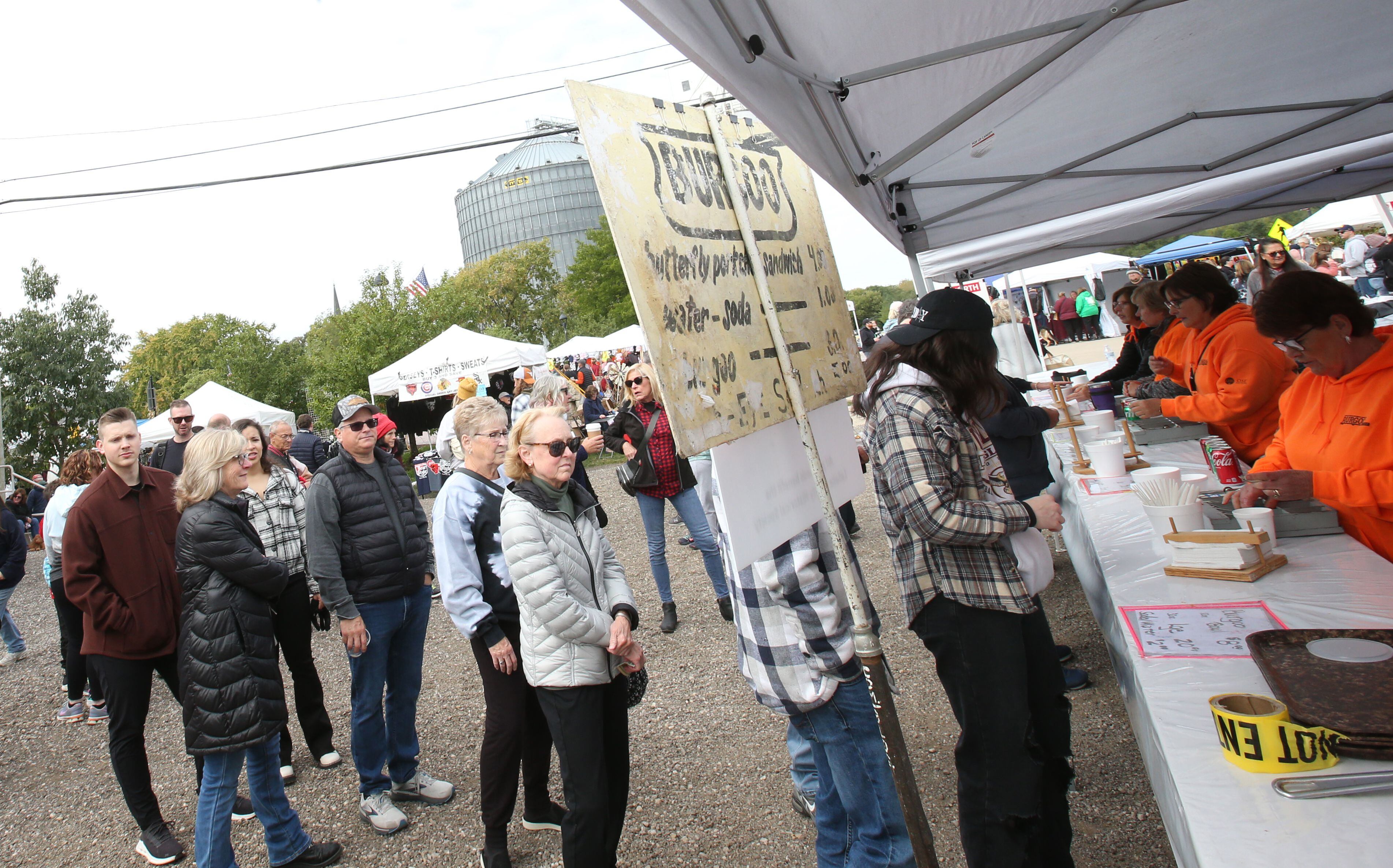 People wait in line to order a bowl of Burgoo stew during the 53rd annual Burgoo on Sunday, Oct. 8, 2023 downtown Utica.