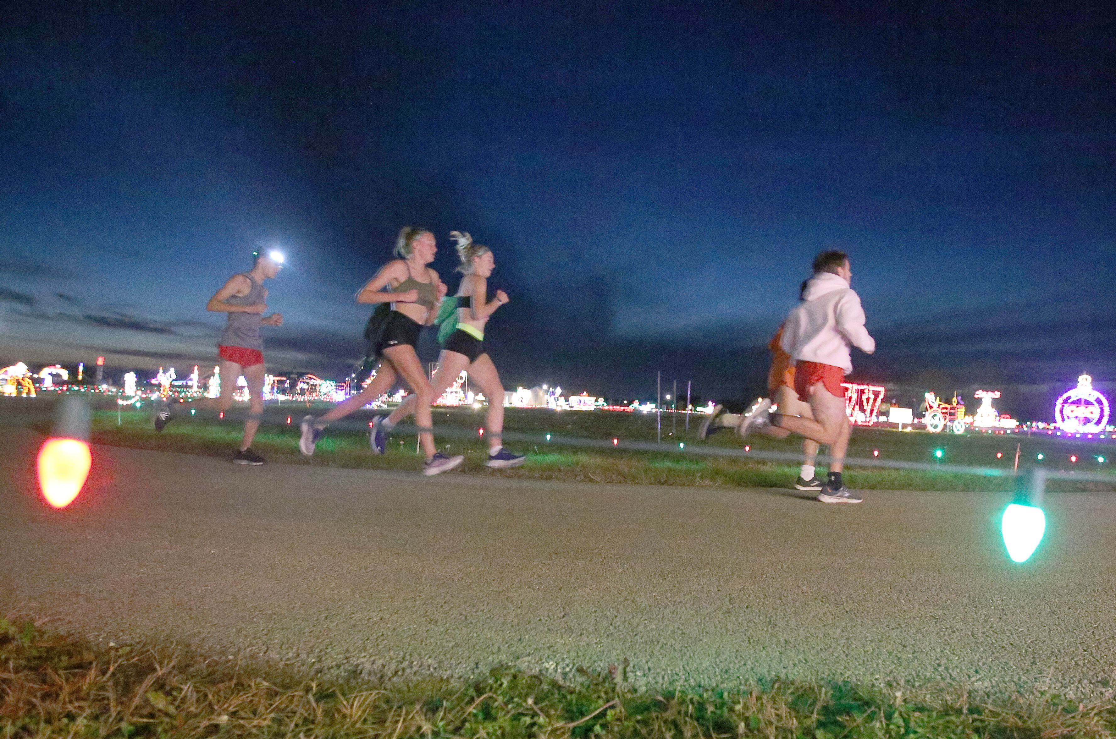 Runners turn a corner during the Run Run Rudolph 5K Fun Run on Sunday, Nov. 5, 2023 at Rotary Park in La Salle. The Celebration Of Lights is the area’s largest drive-thru Christmas light display, stretching throughout Rotary Park on the east side of La Salle.