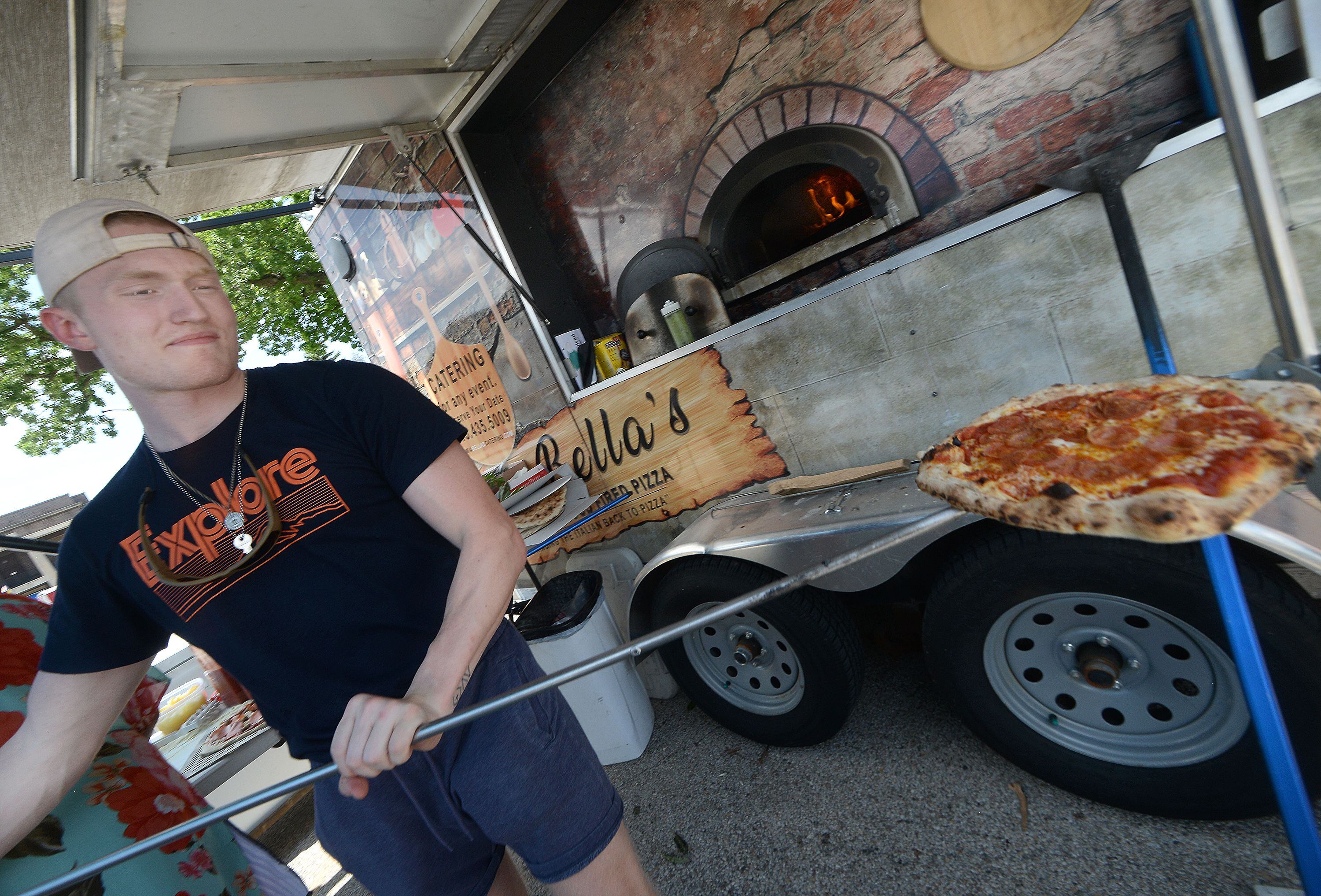 Gerald Harsha, of MiaBella's Wood Fired Pizza, was busy during the 2021 Food Truck Festival in Streator City Park as many lined up for a wood fired pizza.