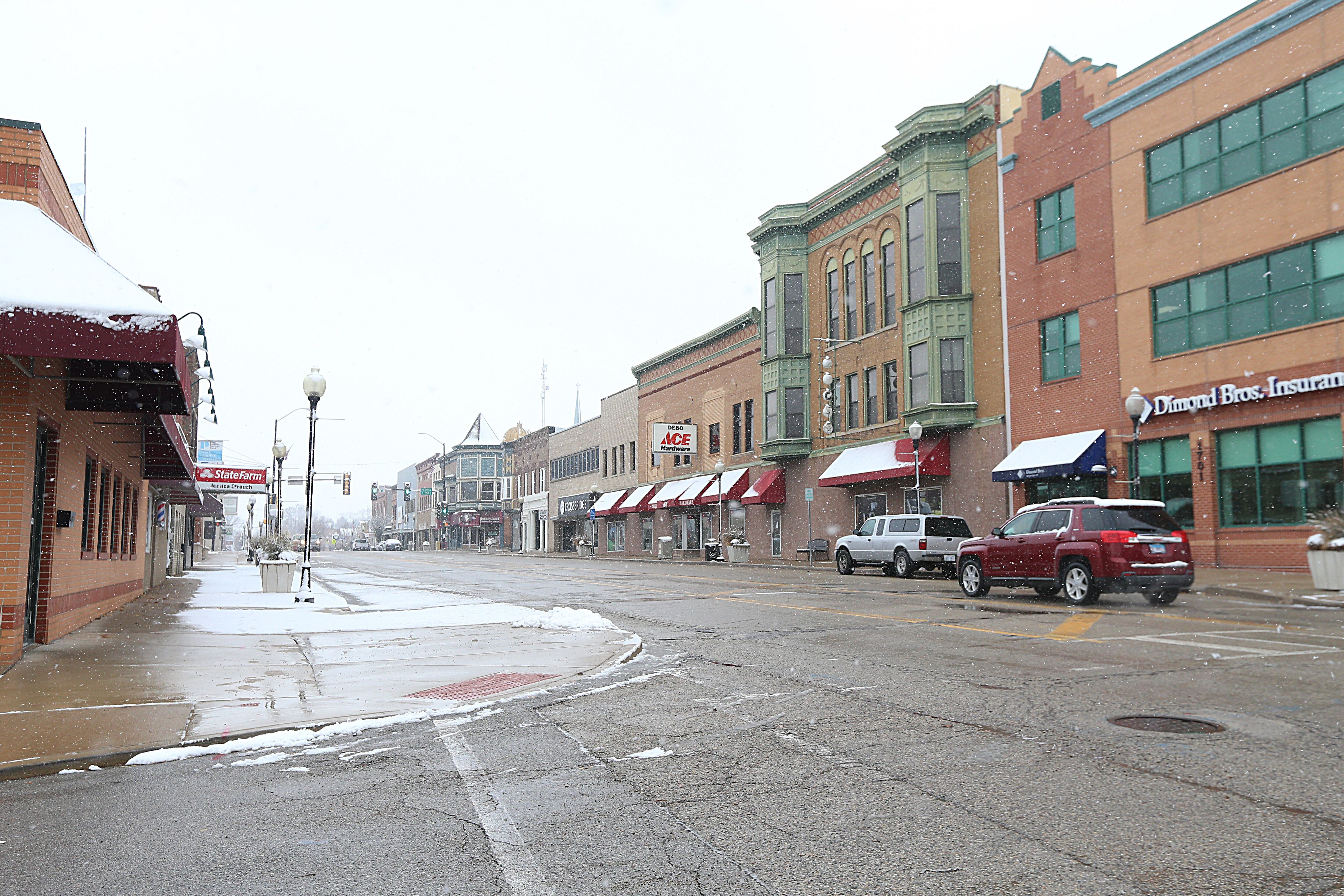 Snow falls into Fourth Street downtown Peru on Tuesday, Nov. 15, 2022 in Peru.
