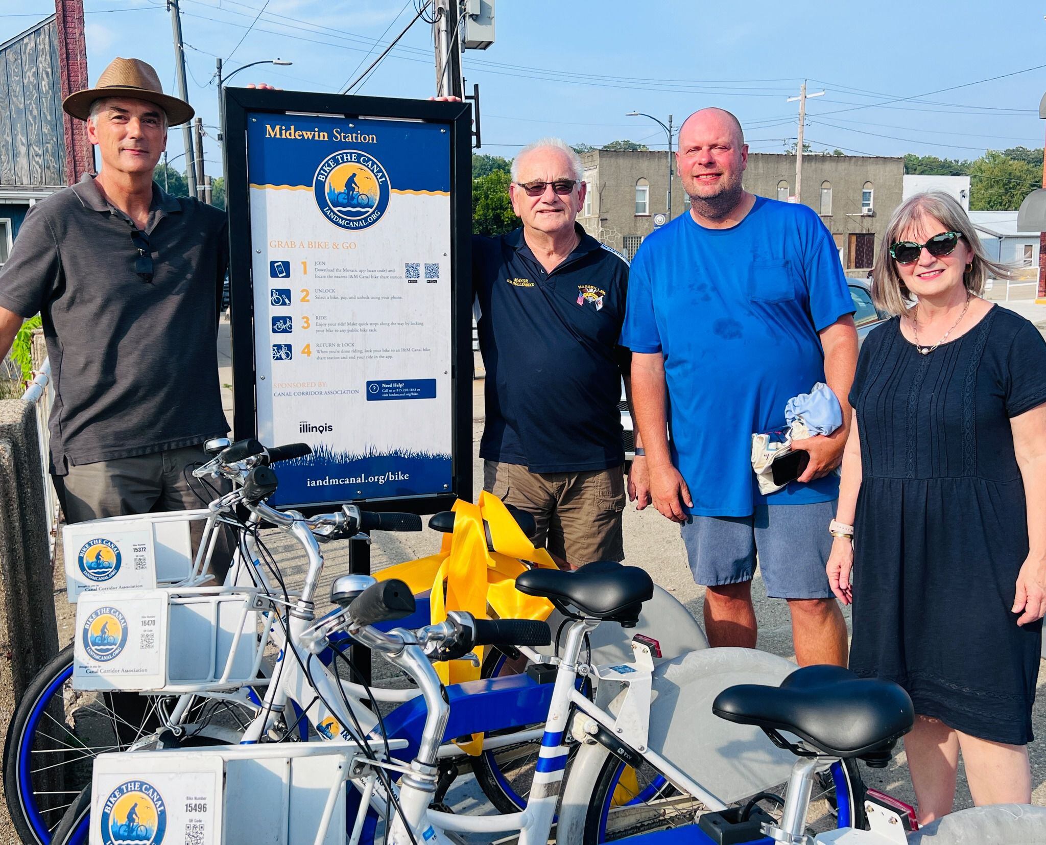 Executive Director of Ottawa Area Chamber of Commerce and Industry Jeff Hettrick, Commissioner Michael Scheib, Marseilles Mayor Jim Hollenbeck and I&M; Canal National Heritage Area president, Ana Koval celebrate the ribbon cutting of Marseilles' new bike station. (Photo provided by I&M; Canal NHA)