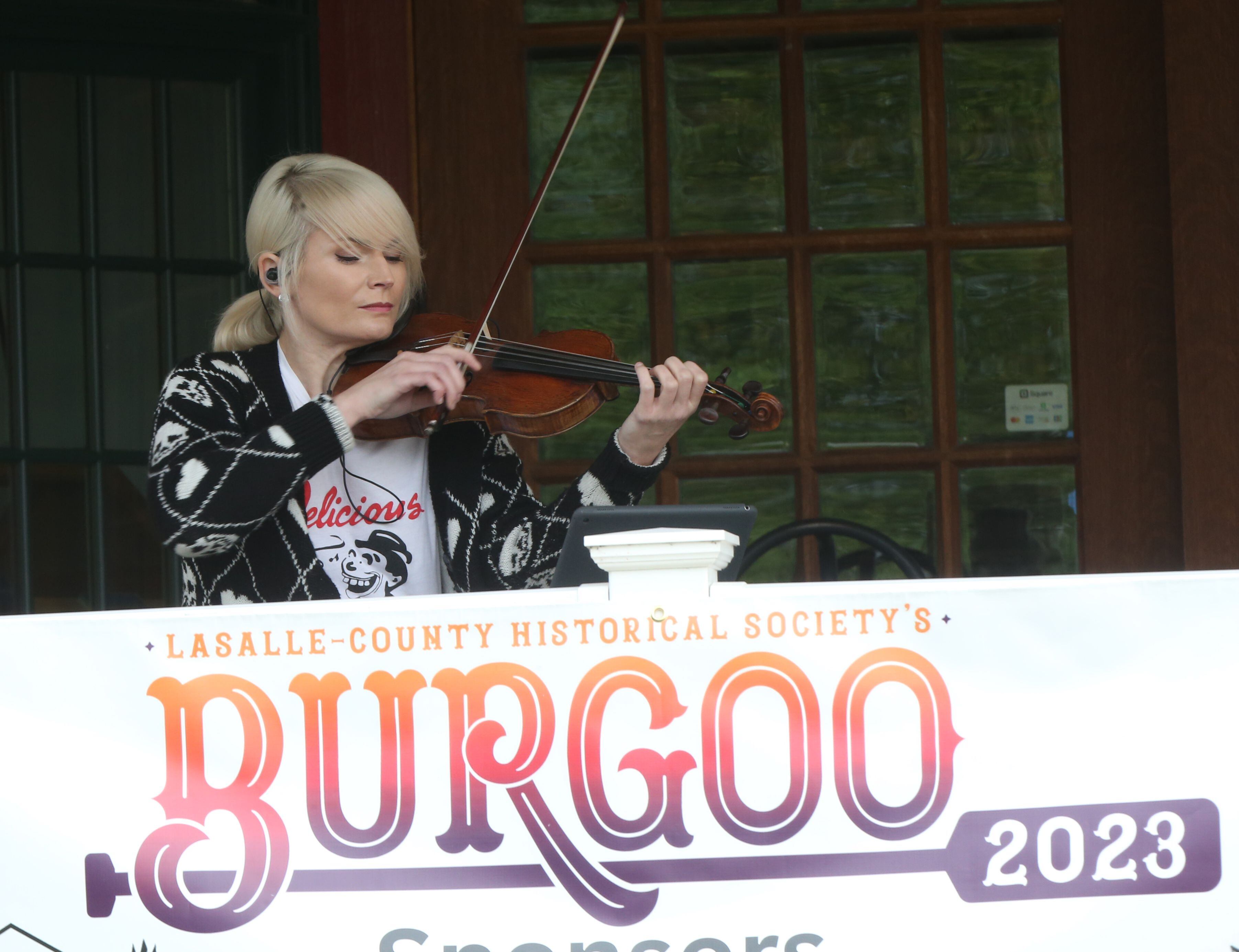 Casey McGrath violinist, plays music on the front porch of the La Salle County Historical Society Canal Market during the 53rd annual Burgoo on Sunday, Oct. 8, 2023 downtown Utica.