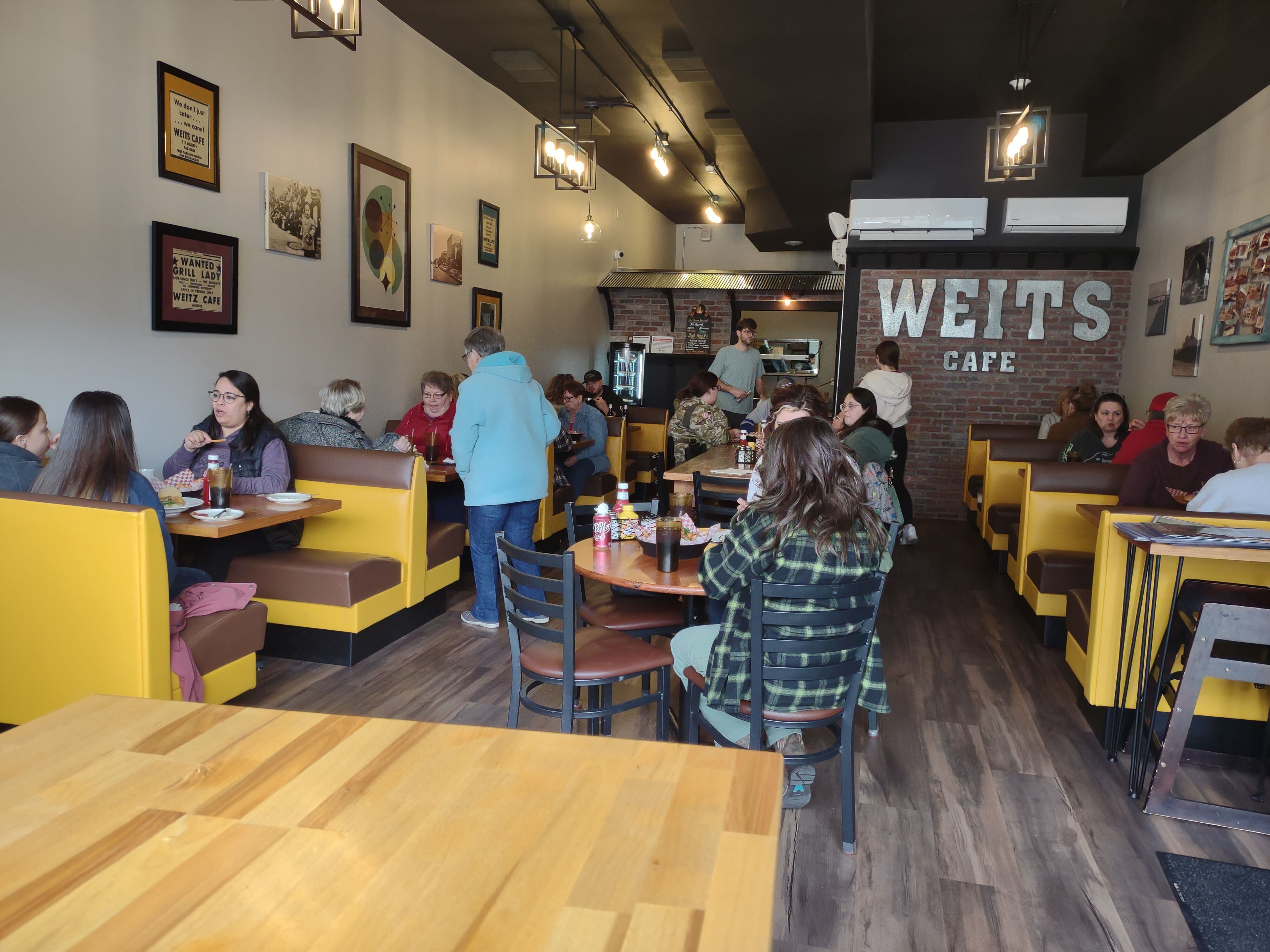 Diners sit at booths and tables and socialize at Weits Cafe in Morris.