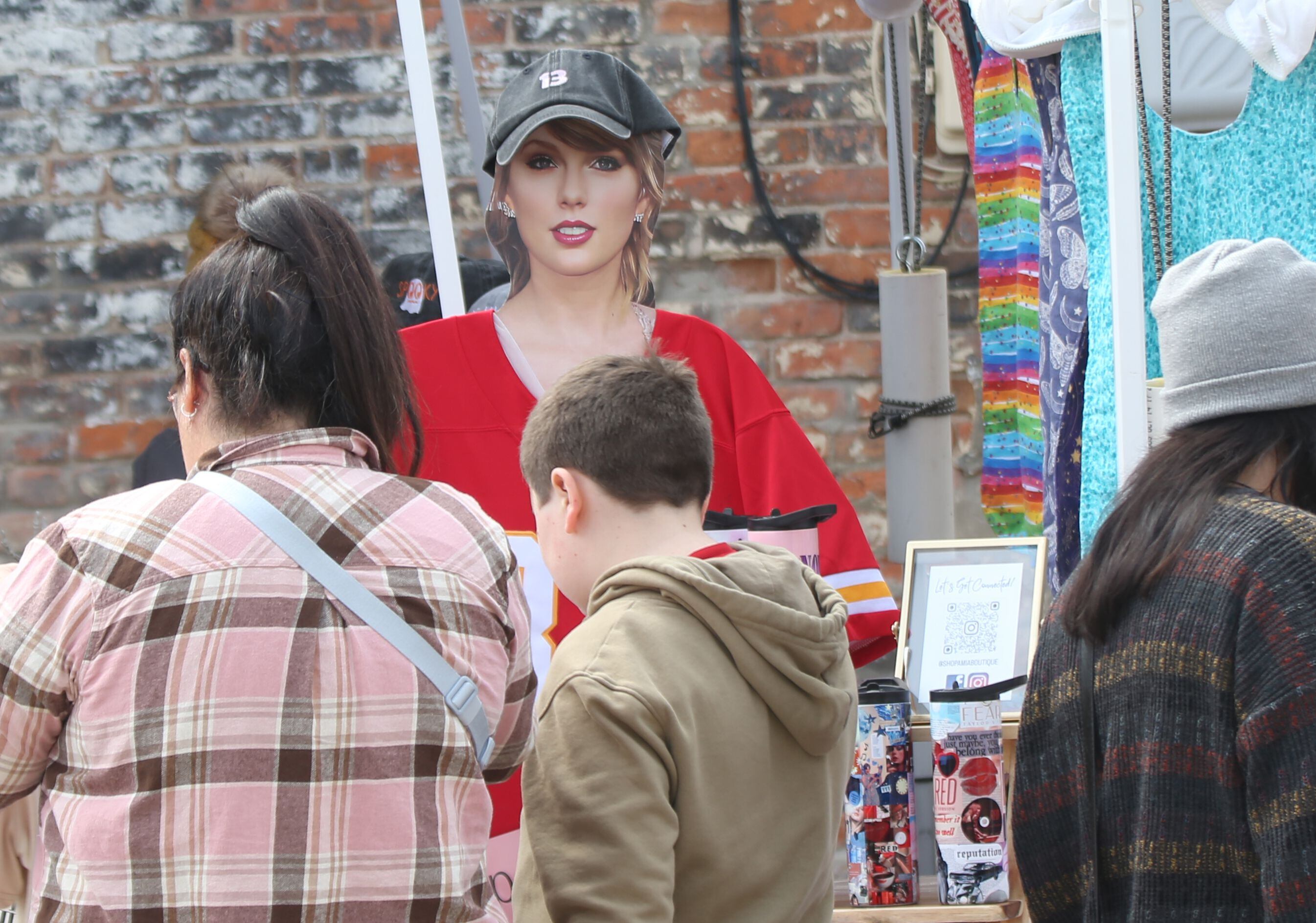 A cardboard cutout of Talor Swift wearing a Travis Kelce jersey was at the Amia Boutique booth during the 53rd annual Burgoo on Sunday, Oct. 8, 2023 downtown Utica.